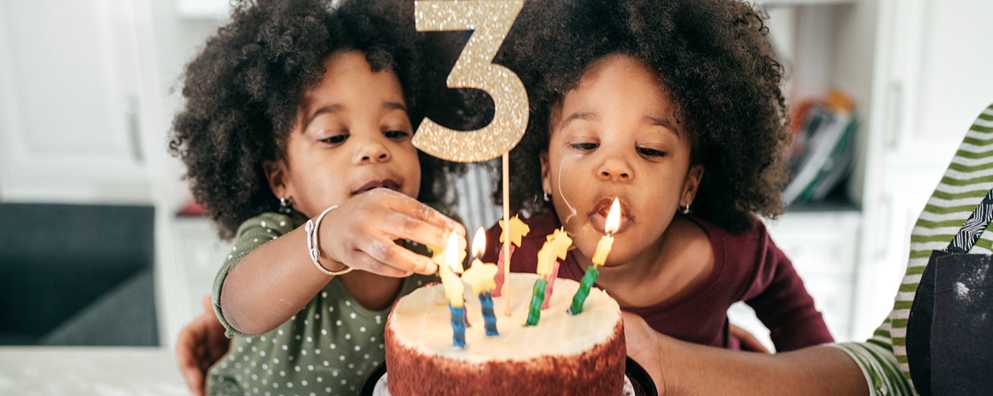 Image of children with a birthday cake