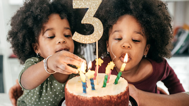 Image of children with a birthday cake
